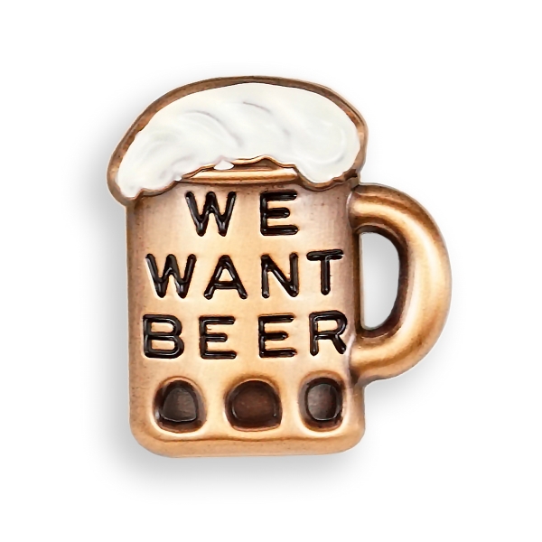 The lapel pin is mug shaped with beer foam at the top of the mug.  The pin is copper toned with the foam "top" painted white, and black text on the mug reading "We Want Beer".