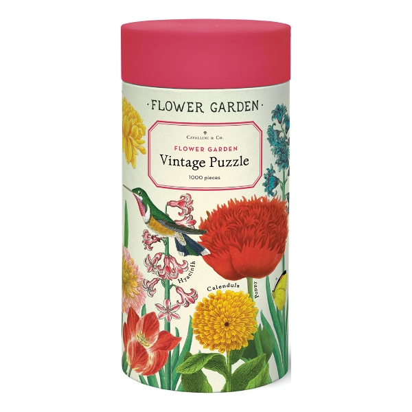 Front of canister holding 1000 piece Flower Garden puzzle. The canister has a red lid and the body of the canister body is wrapped with a print of the floral art of the puzzle.