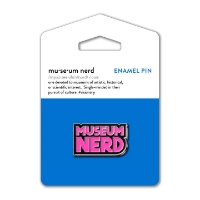 Museum Nerd pin  with pink enamel text that says "Museum Nerd." The pin is mounted on blue display card.