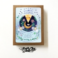 Winter Solstice Moon Card in brown box with cutout window exposing the top card.