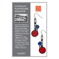 Two polished metal dangle earrings with asymetrical design featuring lower, larger red circle and smaller blue circle above. Shown on retail display card. 