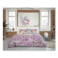 Bedroom setting to show duvet cover with fuschia wildflower design. 