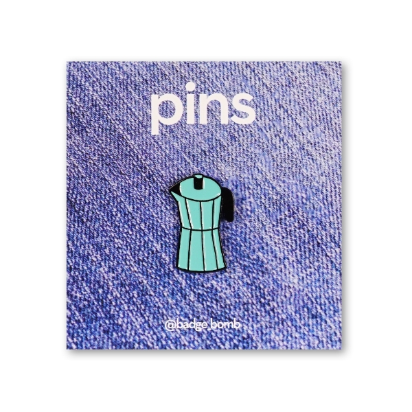 An enamel pin of a teal coffee percolator 