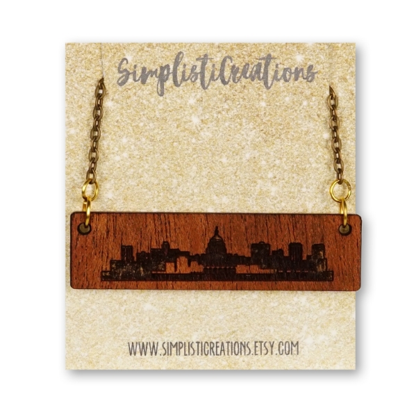 A front view of the Madison Skyline Necklace in its packaging