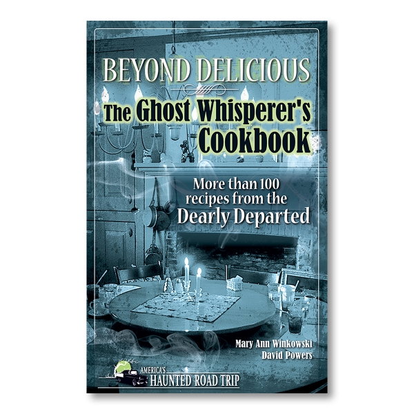 Cover of "Beyond Delicious: The Ghost Whisperer Cookbook: More than 100 Recipes from the Dearly Departed" with the title written over a photo of a table with many candles