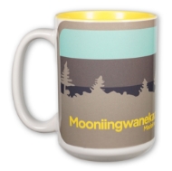 Souvenir Madeline Island Museum mug with landscape design illustration and the First Nations' name "Mooniingwanekaaning."