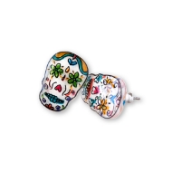 Two earrings that look like sugar skulls in the Dia de los Muertos Mexican tradition. 