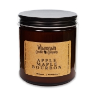 The Apple Maple Bourbon 16 oz candle in brown glass container, open, with black tin screw top leaning on side.