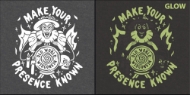 Glow-in-the-dark "Halloween" sweatshirt design featuring a witch, candles, flames, a skull, and the words "Make Your Presence Known." Right side shows greenish glow-in-the-dark feature. 