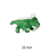 Green stuffed animal hodag monster toy with white horns and fangs.