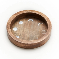 Brown, round, wood dish with metallic moon phase inlays around the perimeter. 