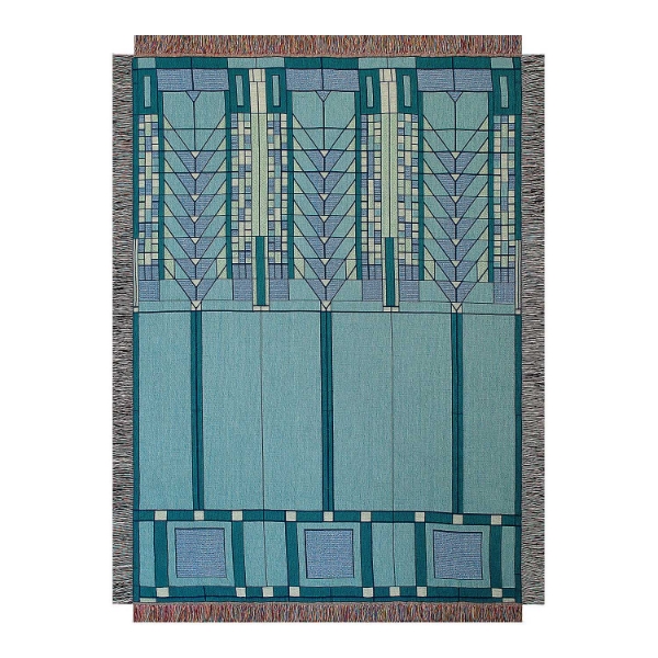 Throw blanket with geometric Frank Lloyd Wright "Tree of Life" design in light blue. 