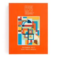 Box top of Frank Lloyd Wright "December Gifts" puzzle with colorful geometric design on orange background. 