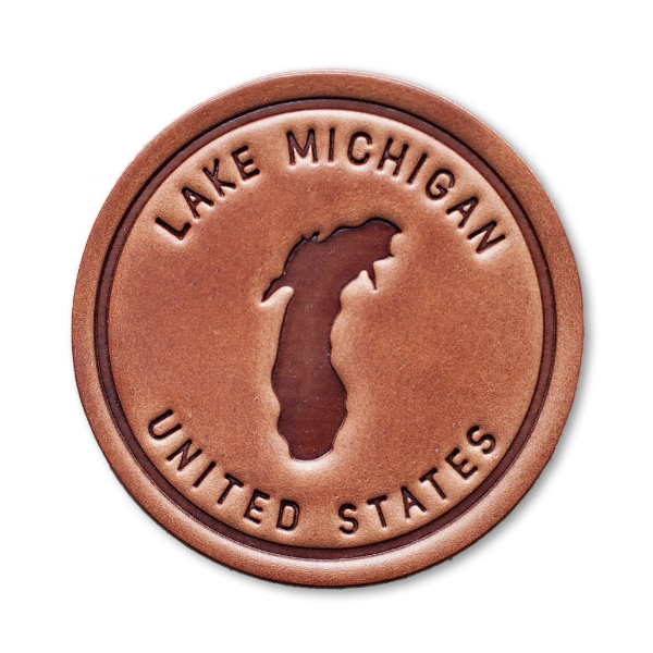 The front of the Lake Michigan Leather Coaster on a blank white background