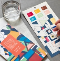 Frank Lloyd Wright "Paint-In Print Set" with paint brush in action painting a card.