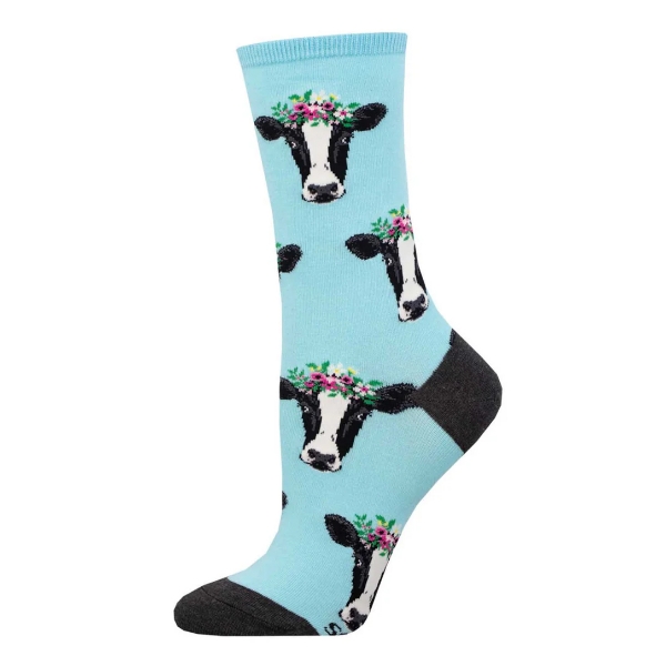 Light blue socks with an illustration of a cow's faces printed all over.